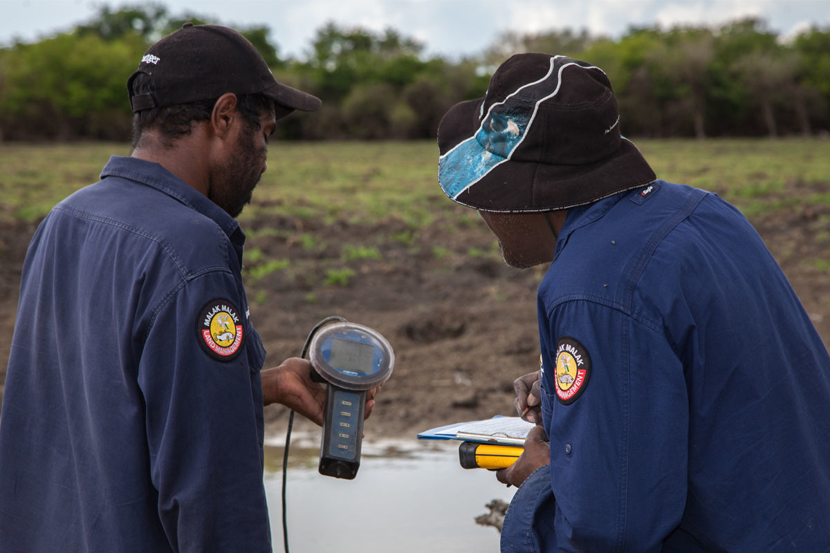 Indigenous rangers testing water quality at Daly River, NT.