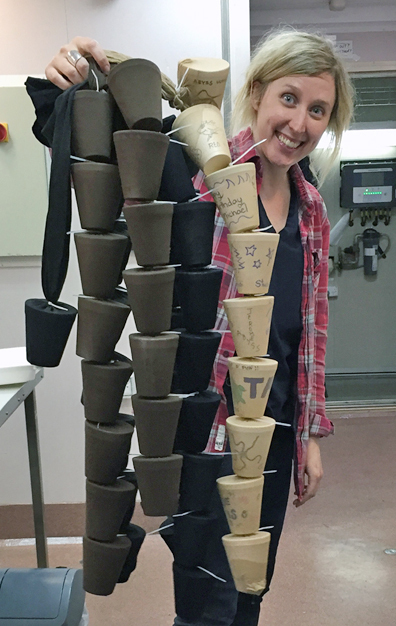 Phoebe Lewis with strings of cups