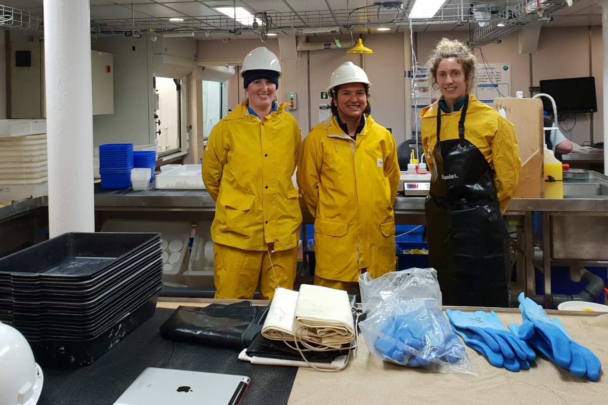 Three women prepared to sort biological samples