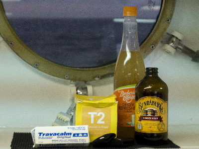 A collection of ginger products in front of a porthole